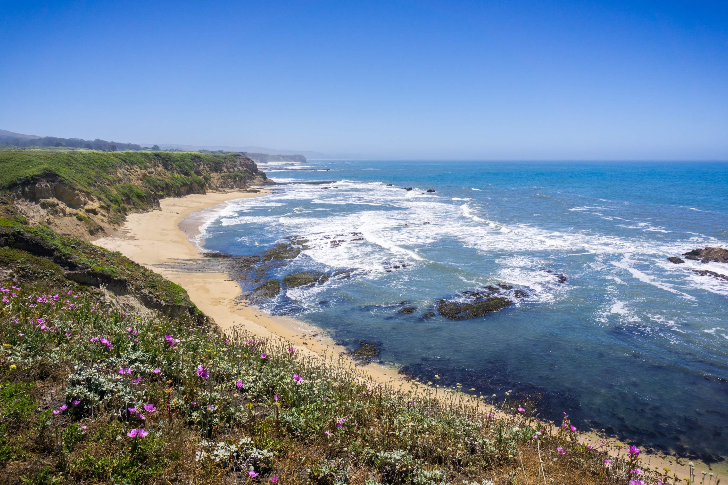 Half Moon Bay coastline, surf breaking against the cliffs