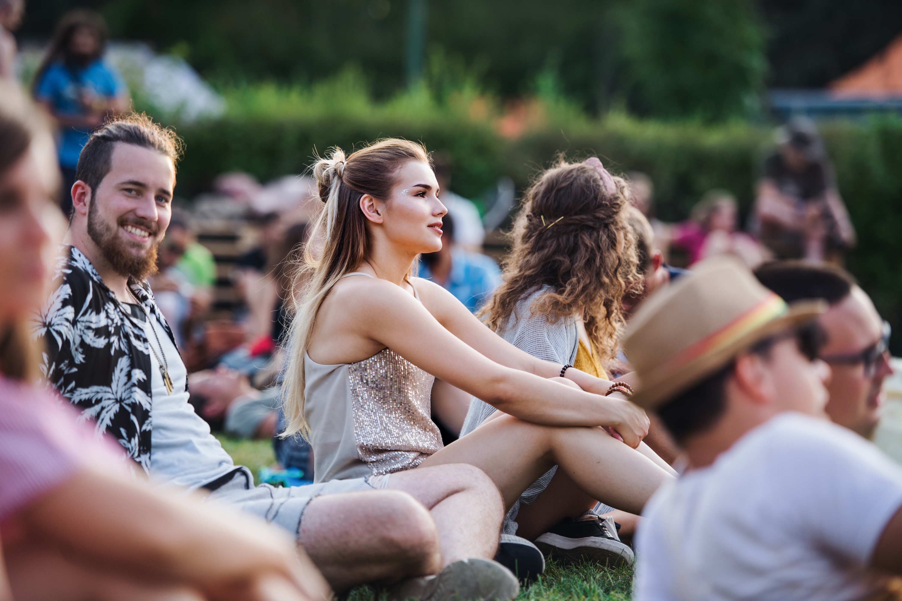Friends enjoying a summer festival on the lawn
