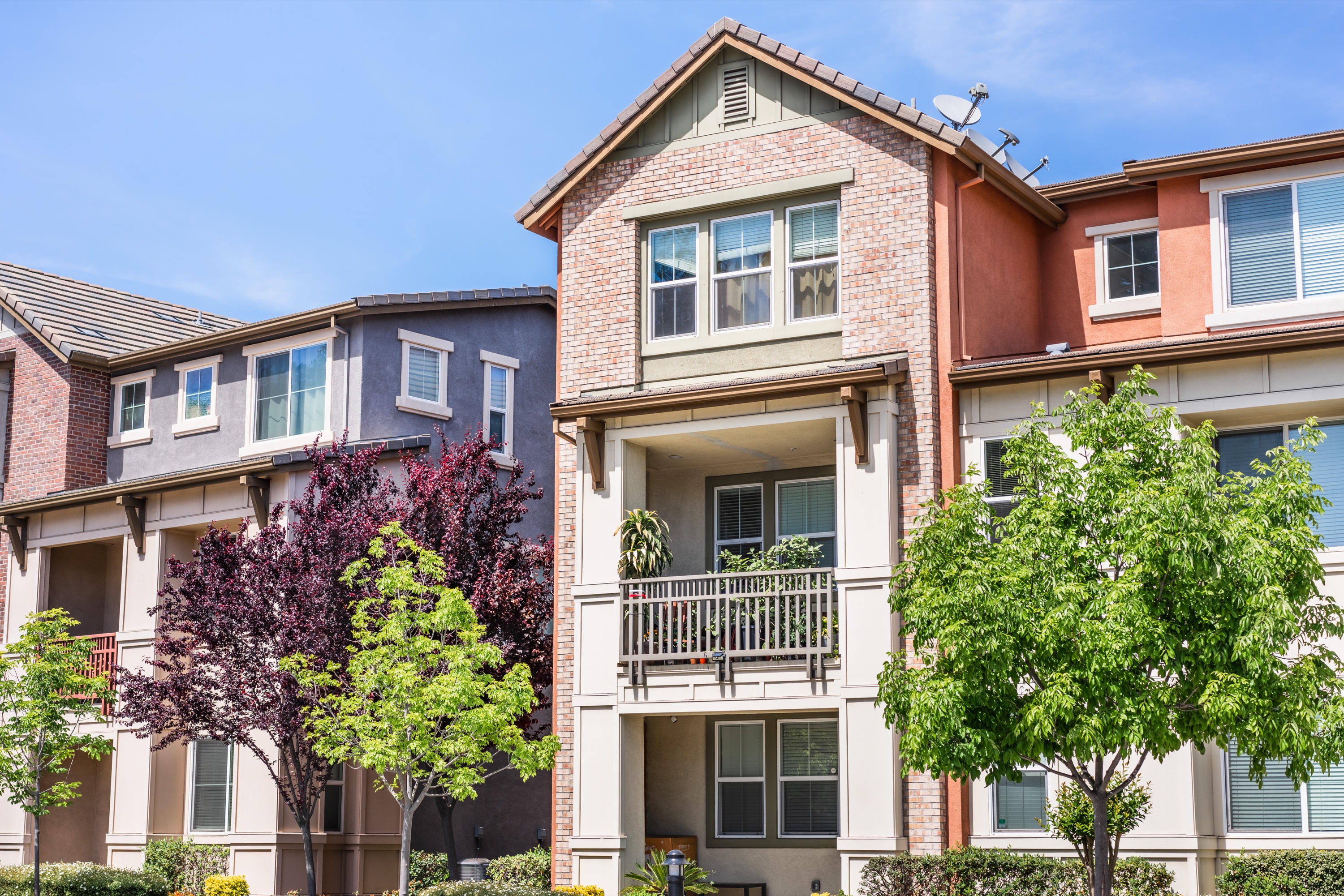 Modern multi-color townhouse architecture &mdash; Los Altos teardown-rebuilds increasingly look like this when modern buyers commission new construction.