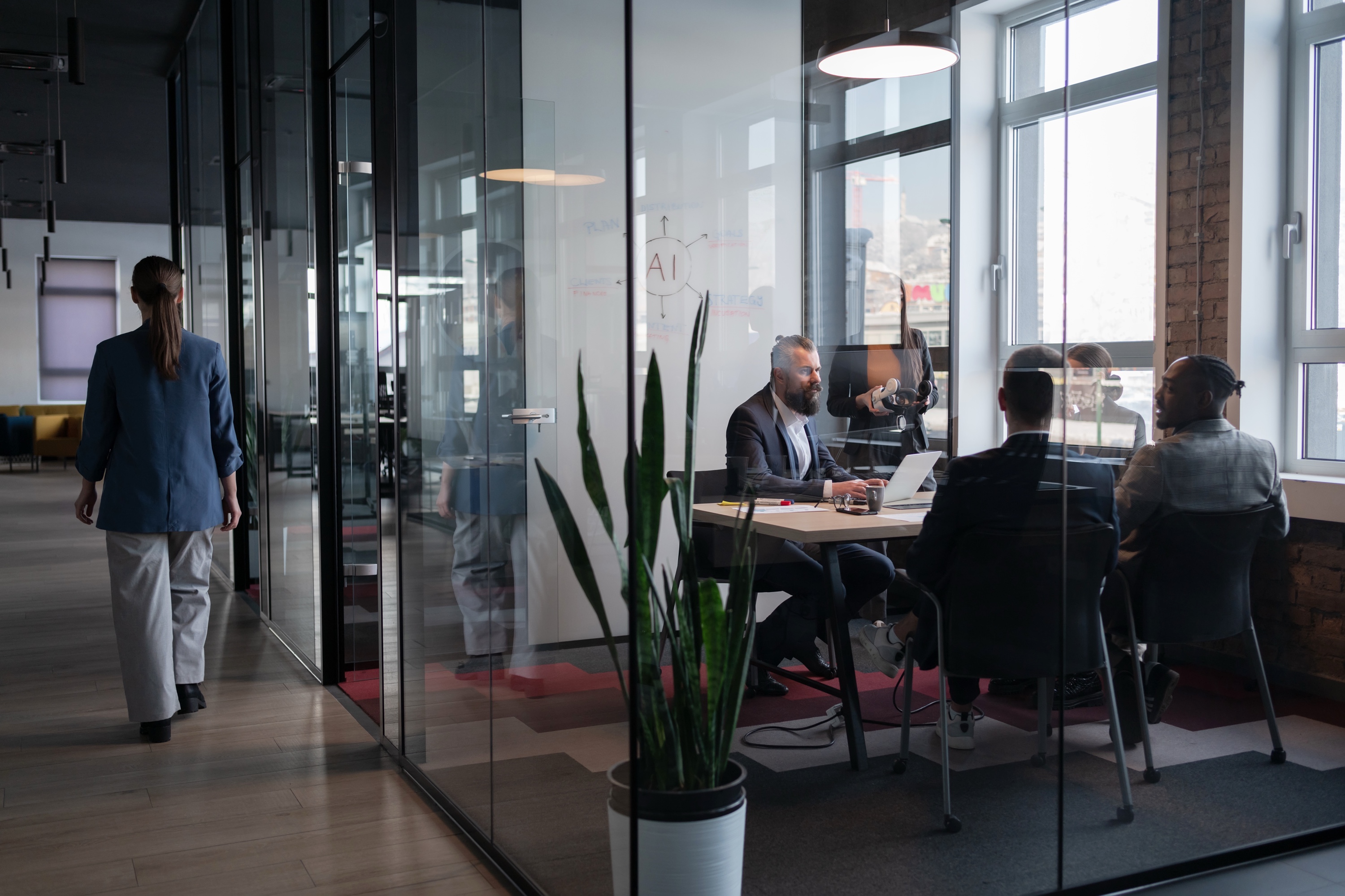 Modern glass-walled office meeting