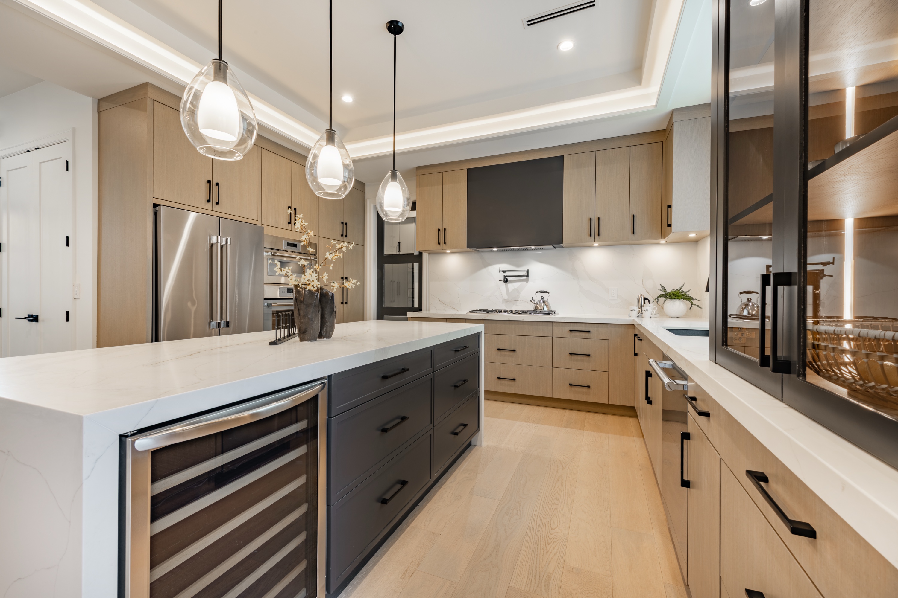 New construction single-family home kitchen with island and bar stools
