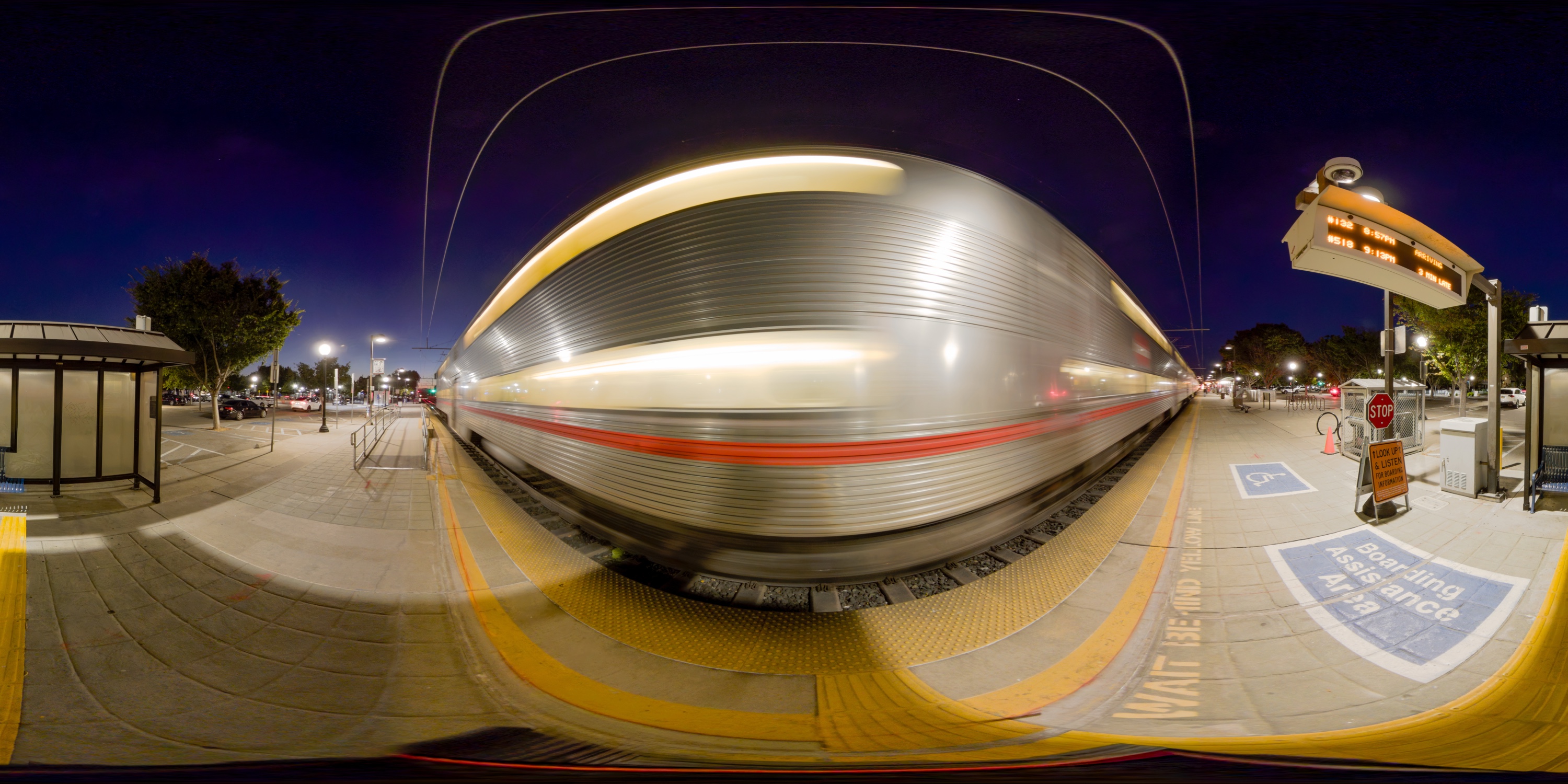 Evening panorama of a train passing the Mountain View station